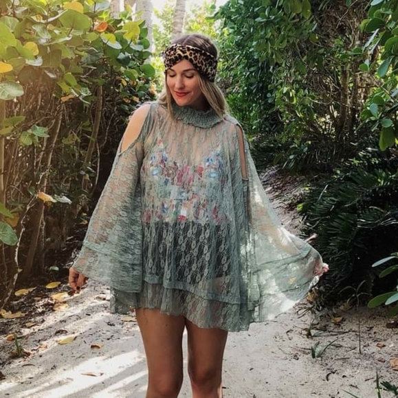 easel Tops - Lace poncho with cold shoulders.